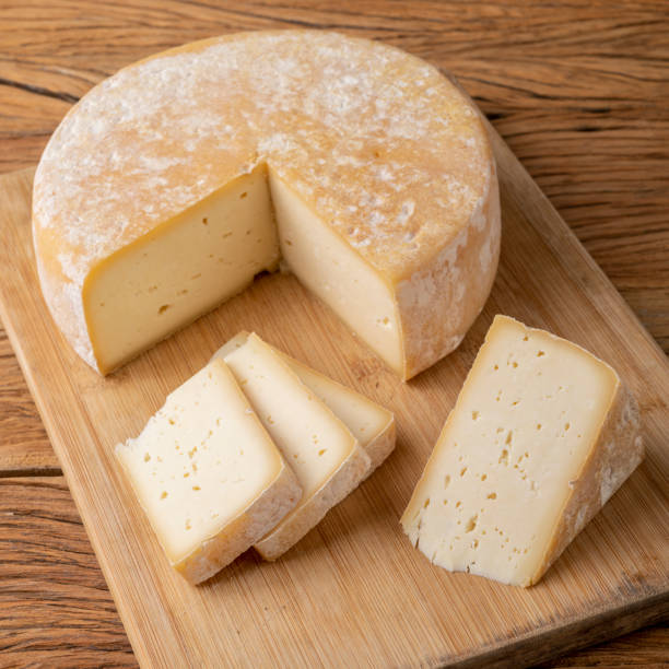istock Artisanal Canastra cheese from Minas Gerais, Brazil over wooden board 1319046486