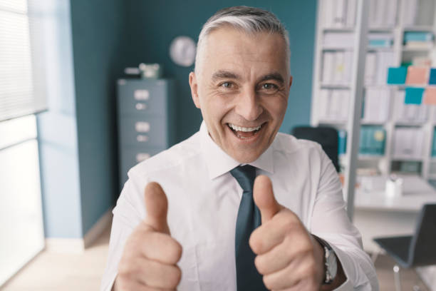 istock Cheerful executive giving a thumbs up 1319046850