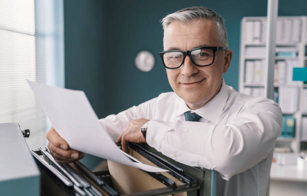 istock Businessman searching for files and documents 1319046981