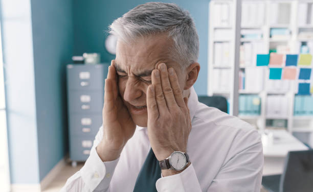 istock Corporate businessman having a bad headache 1319047271