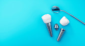 Dental implants isolated on blue background