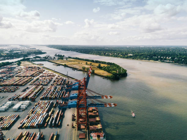 istock high angle view on Cargo crane container terminal in Hamburg 1319049096