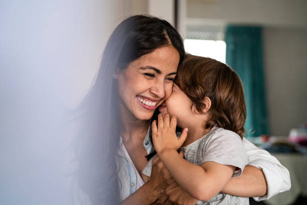 istock Mother and son embracing each other at home 1319049185