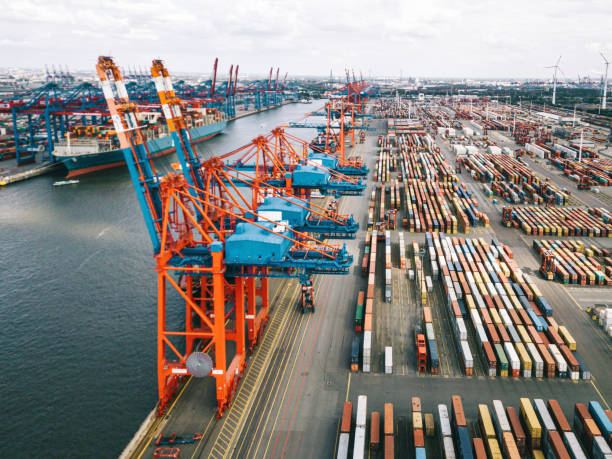 istock high angle view on Cargo crane container terminal in Hamburg Harbor 1319049261