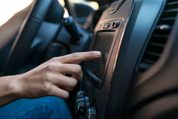 istock Close-up of woman´s hand touching satnav device inside car 1319050217