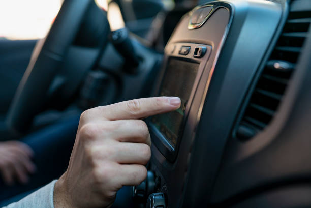 istock Close-up of man´s hand touching satnav device inside car 1319050330