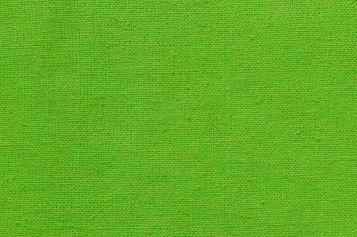 Light green cotton fabric texture background, seamless pattern of natural textile.