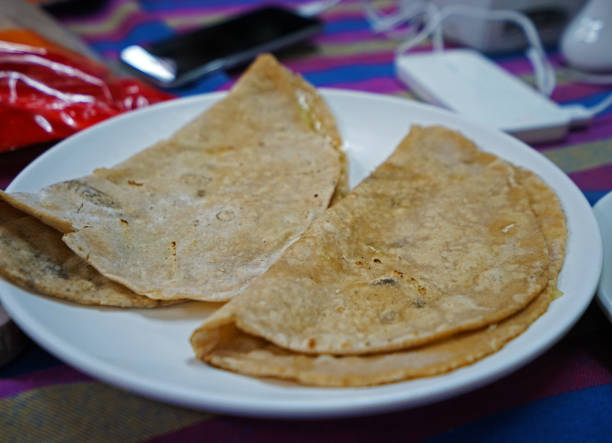 istock Close up plain Gurung bread (Pan fried Nepali pastry) normally served with honey, fruit jam or peanut butter 1319054360