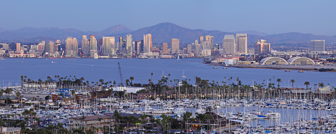 High-angle Night time panoramic view of the San Diego skyline, San Diego bay and recreational boats at Shelter island as seen from Point Loma.