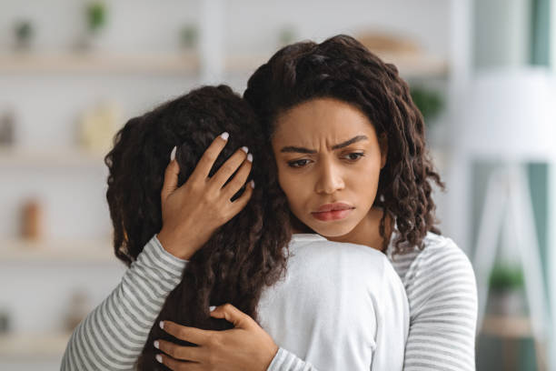 istock Young black mother comforting her crying daughter 1319055352