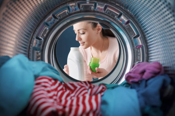 istock Woman smelling a scented laundry detergent 1319059843