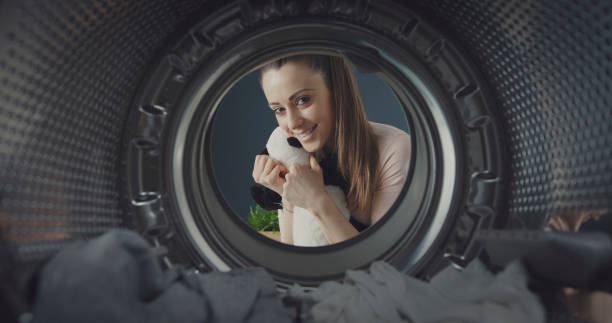 istock Woman washing a plush in the washing machine 1319060130