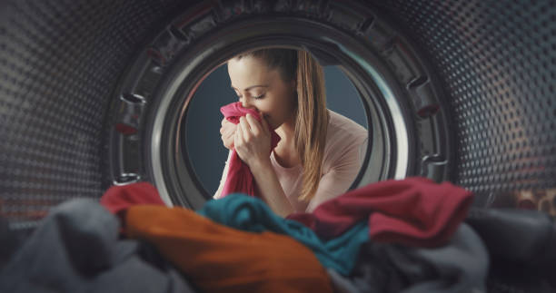istock Woman smelling freshly washed laundry 1319061179