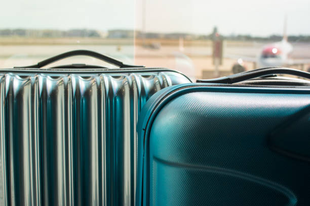 istock 2 suitcases at the airport 1319061924