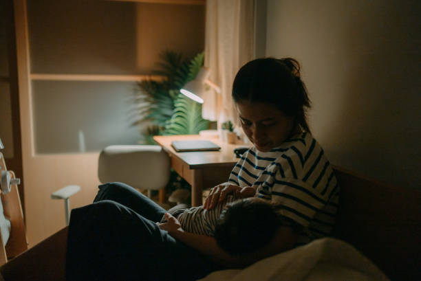 A woman breastfeeding her baby.