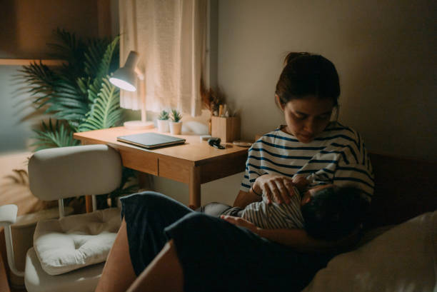 istock Mother breastfeeding baby. 1319065778