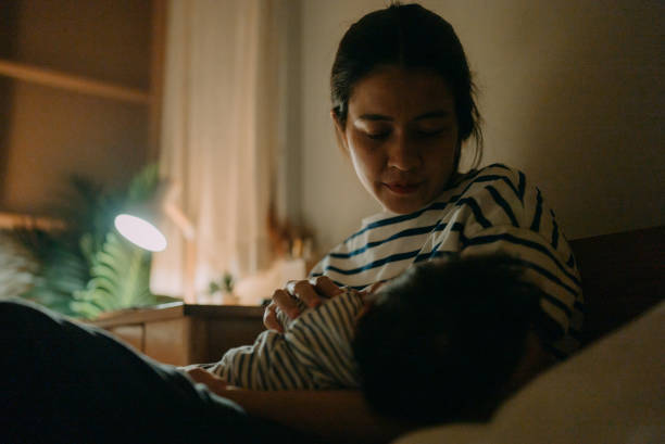 istock Mother breastfeeding baby. 1319065805