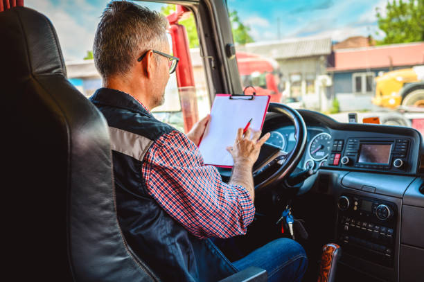 istock Mature truck driver with clipboard 1319066780