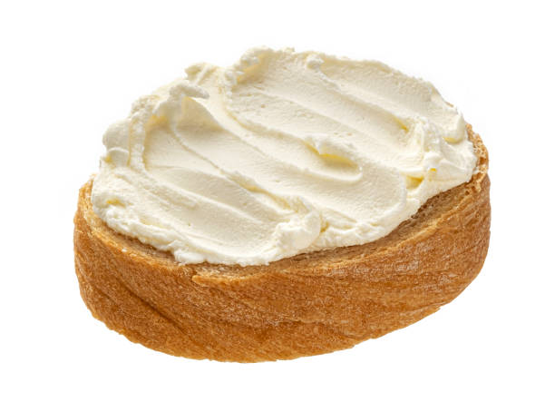 istock Bread with cream cheese isolated on white background 1319068610