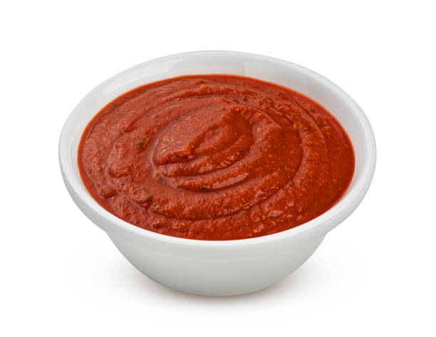 istock Bowl of tomato soup isolated on white background 1319068613