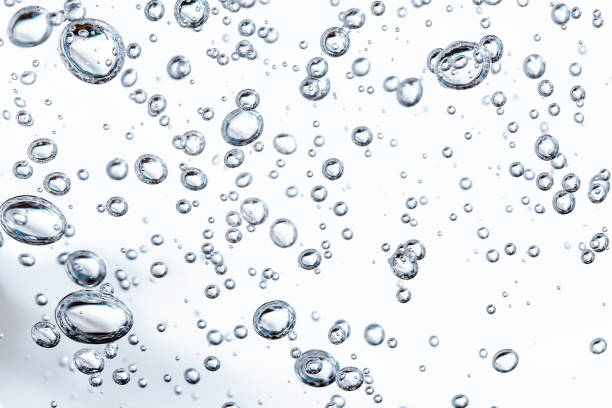 istock Close up macro Aloe vera gel cosmetic texture blue background with bubbles. 1319068746