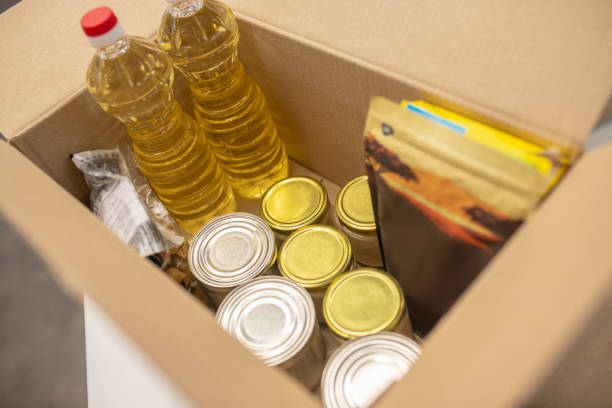istock Food and clothing in an open donation box 1319072076