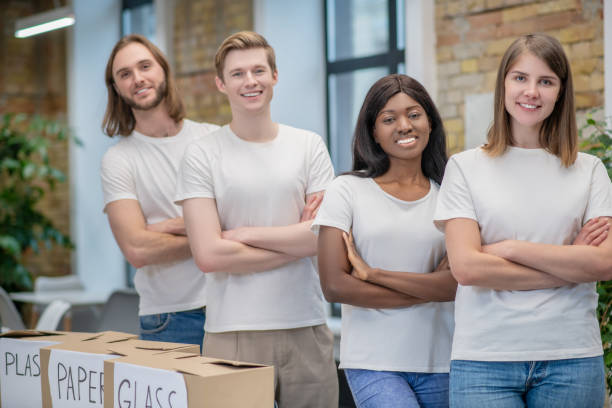 istock Group of young people at recycling center 1319072109
