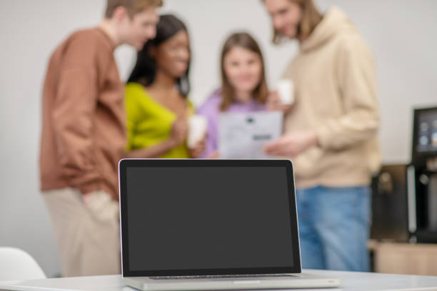 istock Group of students talking in office of youth organization 1319072129
