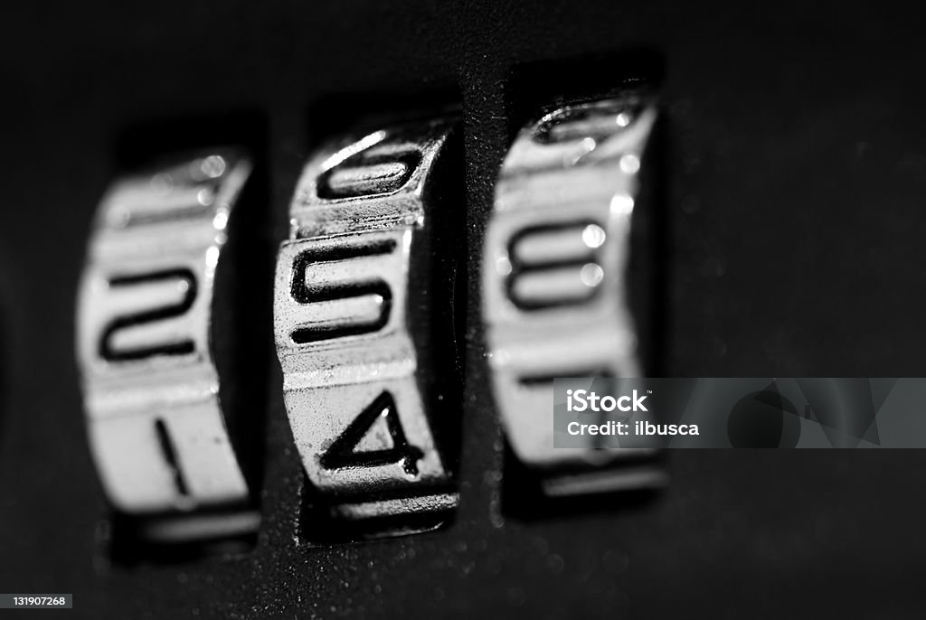 Luggage lock code black and white macro Black And White Stock Photo