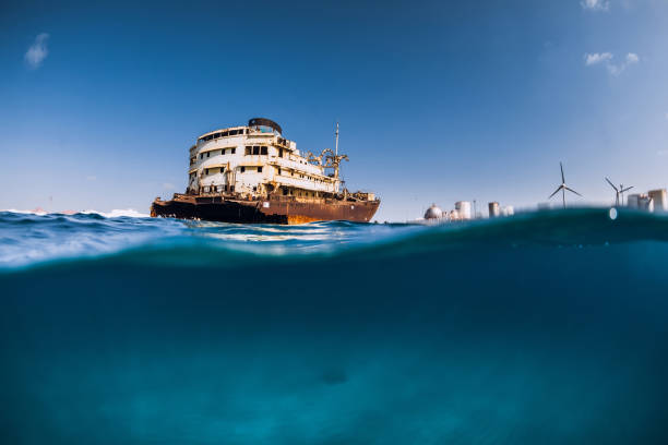 istock Old wreck ship in blue ocean in Arrecife, Lanzarote. Split shot. 1319076690