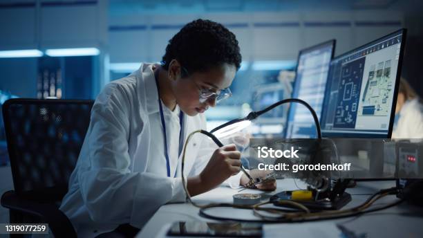 Modern Electronics Research Development Facility Black Female Engineer Does Computer Motherboard Soldering Scientists Design Pcb Silicon Microchips Semiconductors Medium Closeup Shot Stock Photo - Download Image Now