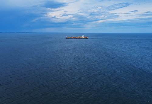 A distant container ship on the Atlantic.