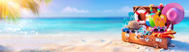 istock Beach Holiday - Travel Suitcase On Tropical Sand With Sunny Sea 1319081473