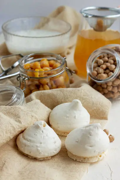 Vegan meringue, boiled and dried chickpeas, and aquafaba. Vegan cooking concept. A healthy product. Vegan Egg Substitute