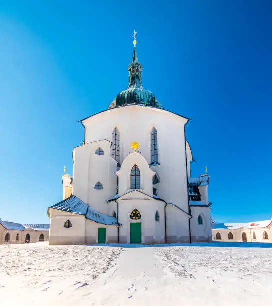 The Pilgrim Church of St. John of Nepomuk on Zelena Hora - Green Mountain, Zdar nad Sazavou, Czech Republic, UNESCO heritage. Winter weather with snow. Sunny frozen day.