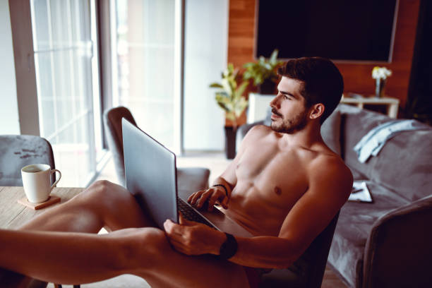 istock Modern Male Using Laptop While Relaxing With Cup Of Coffee 1319086335