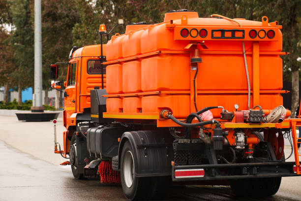 istock An orange watering machine washes the road 1319087115