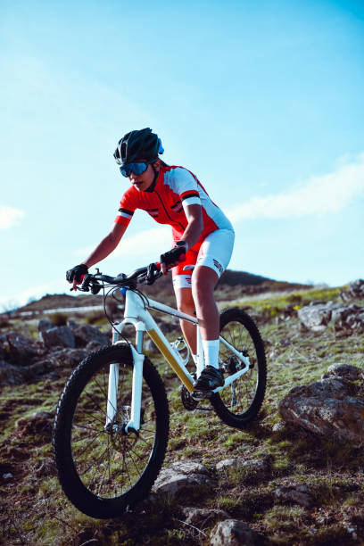 istock Female Cyclist Not Afraid Of Rocky Mountain Landscape 1319087207