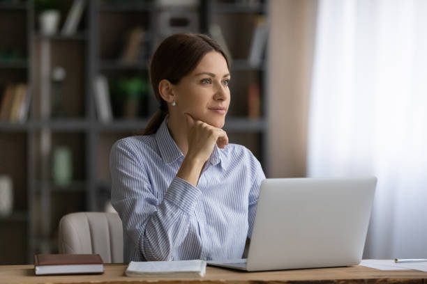 istock Ambitious female student dream of future profession distracted from pc 1319087301