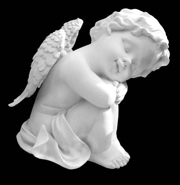 istock Little white guardian angel isolated on black background 1319087390