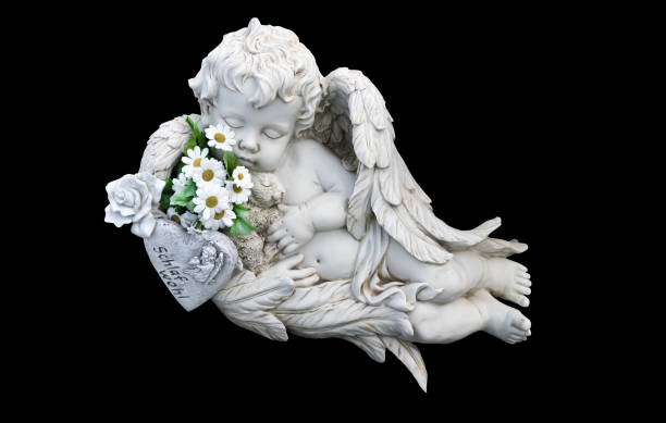 istock Little white guardian angel isolated on black background 1319087409