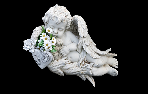 Little white guardian angel isolated on black background