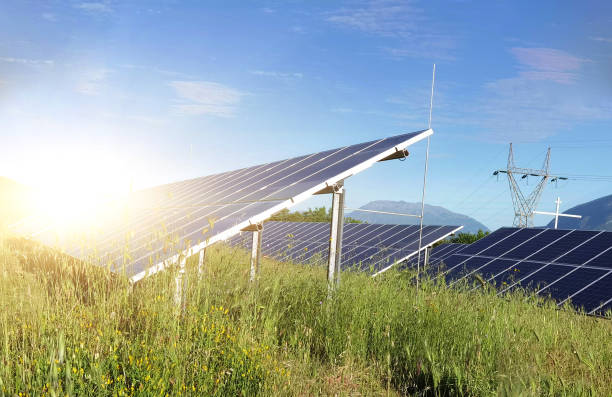 istock solar panels grass sky clouds electricity energy  sun background 1319090155