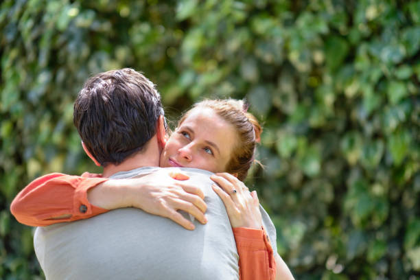 istock Affectionate young couple bonding together outdoors 1319090807