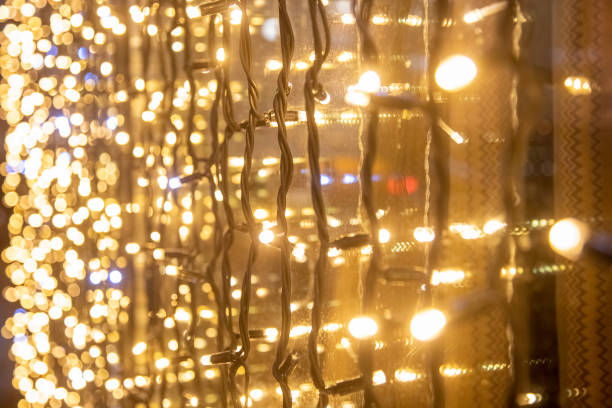 istock yellow wall garland perspective close-up soft focus. Festive blurred backdrop. 1319090934