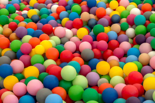 ball pit pool with rainbow colors plastic balls for children to play. dry pool - ball pool imagens e fotografias de stock