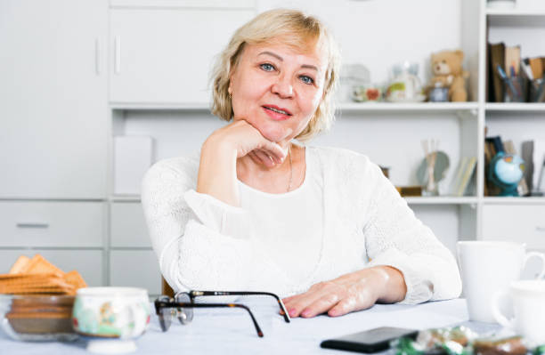 istock Mature woman at home 1319091489