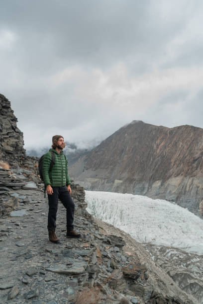 istock Man looking at glacier in Pakistan 1319092879