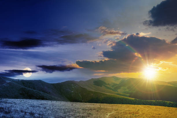istock day and night time change above mountain landscape 1319093790