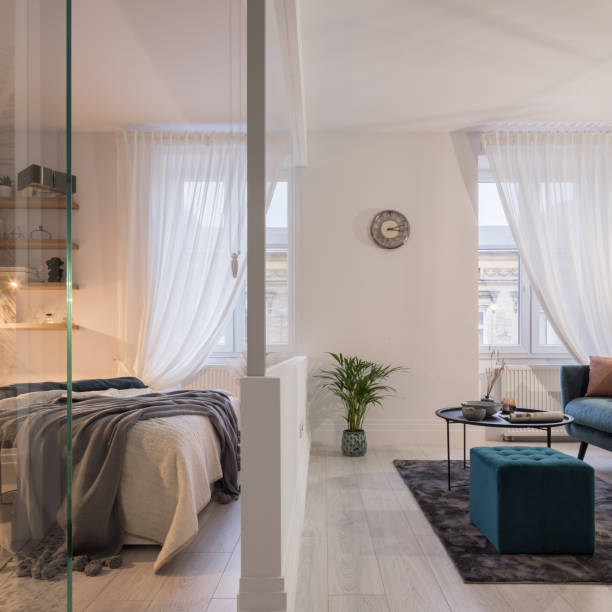 istock Glass wall between bedroom and living room 1319094383